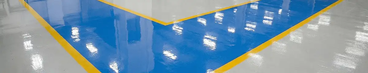 A factory floor professionally covered and marked with epoxy flooring in Naperville, IL