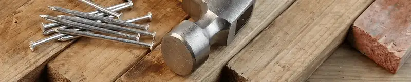 Hammer and nails on hardwood flooring boards in Naperville, IL