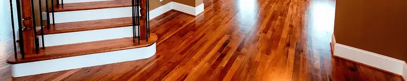 Base floor of a staircase with professionally restored wood flooring in Naperville IL